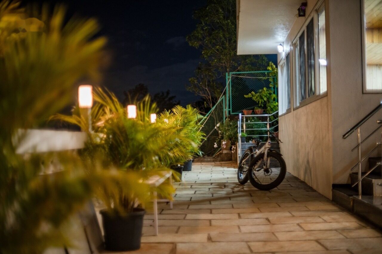 Villa exterior lit up at night