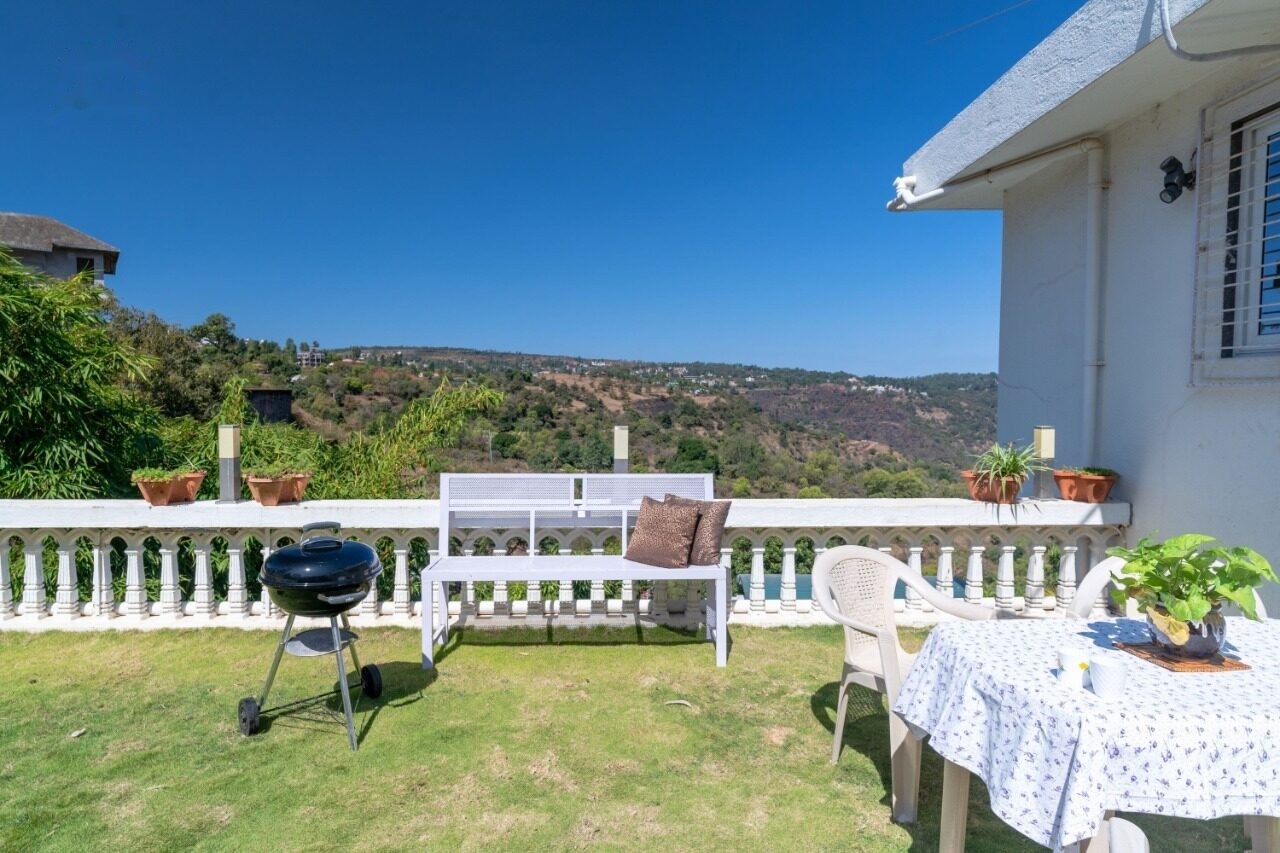 Outdoor barbecue and dining area on the lawn